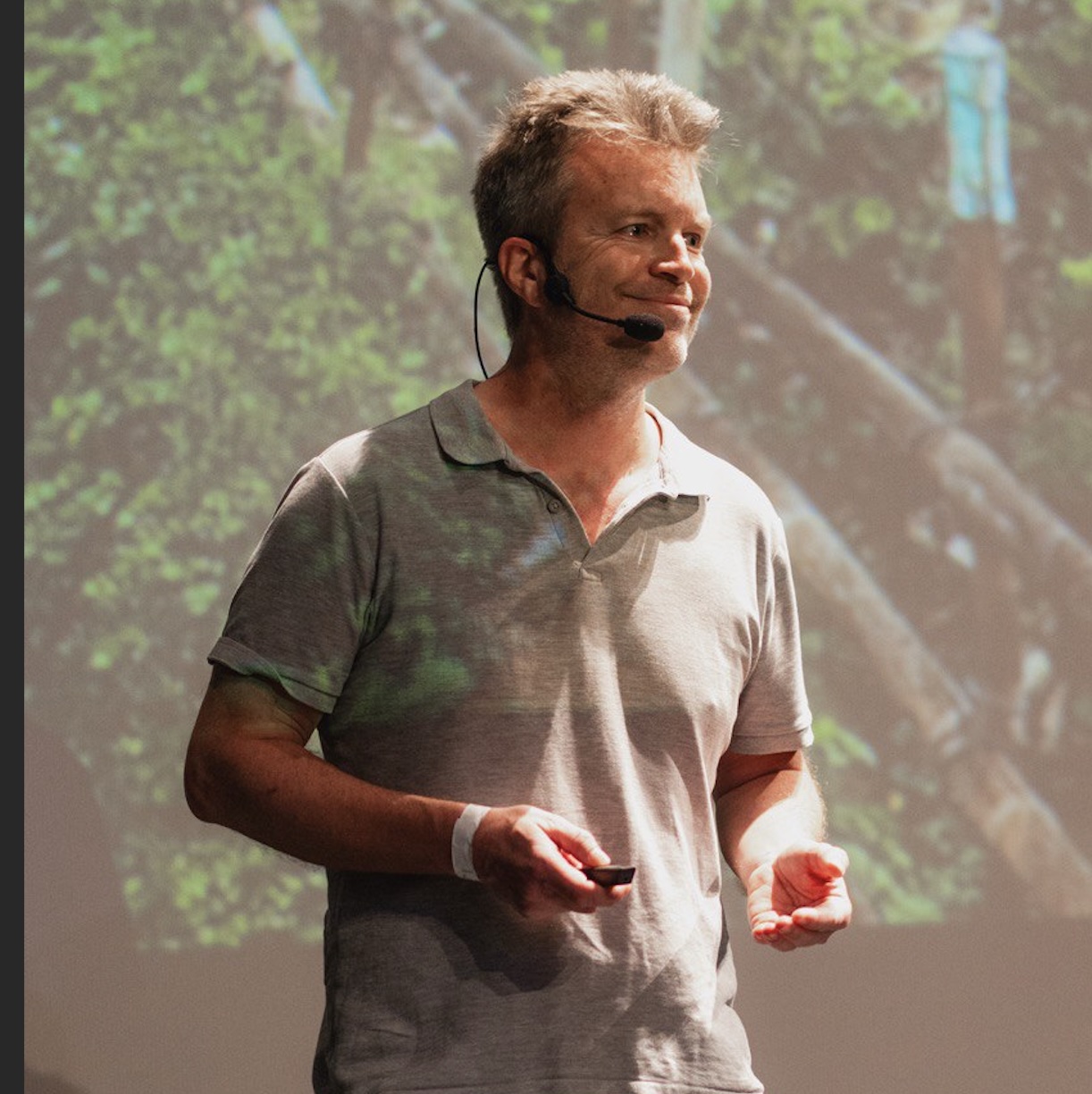 Jean-Baptiste speaking at a conference